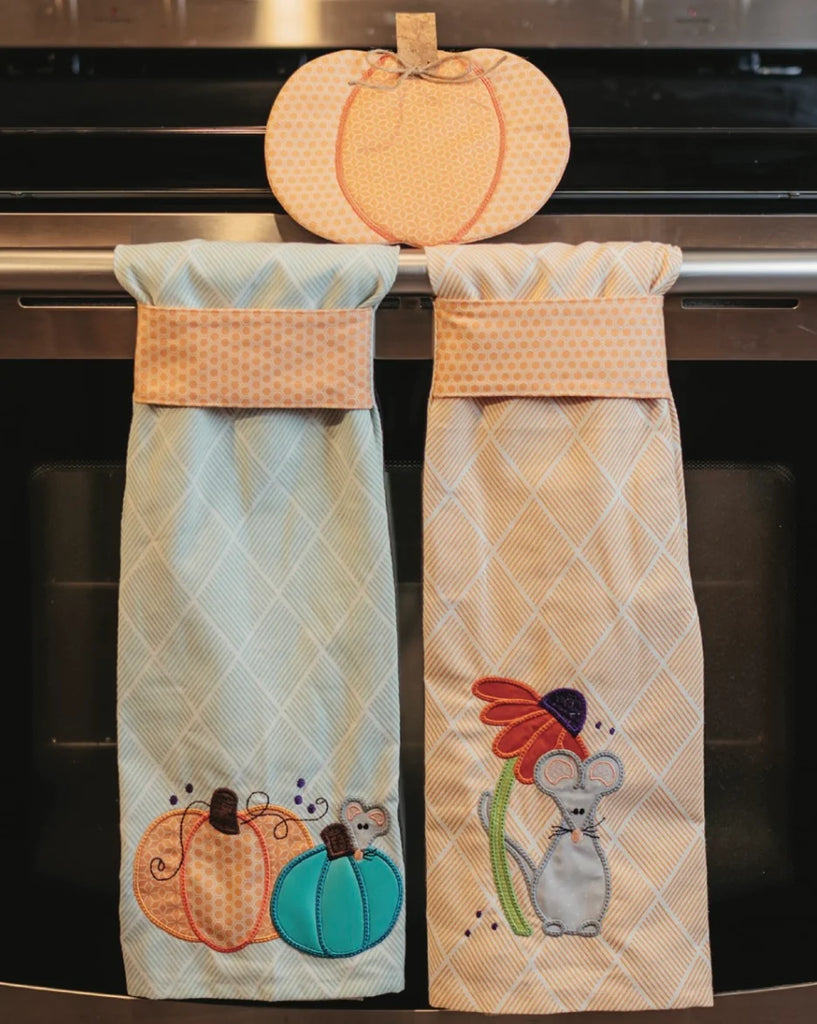 Harvest Mouse Tea Towels hanging on oven door.