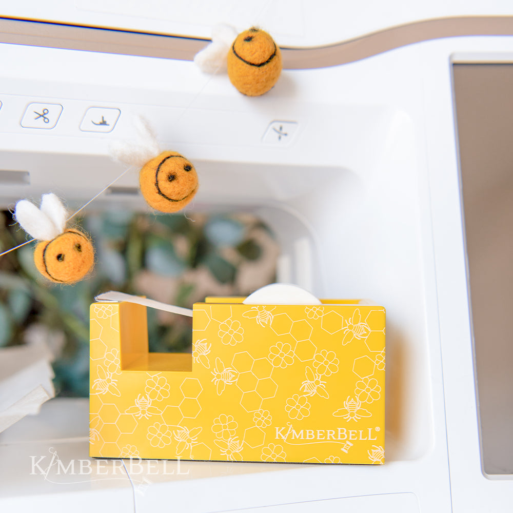 yellow paper tape dispenser with bee pattern