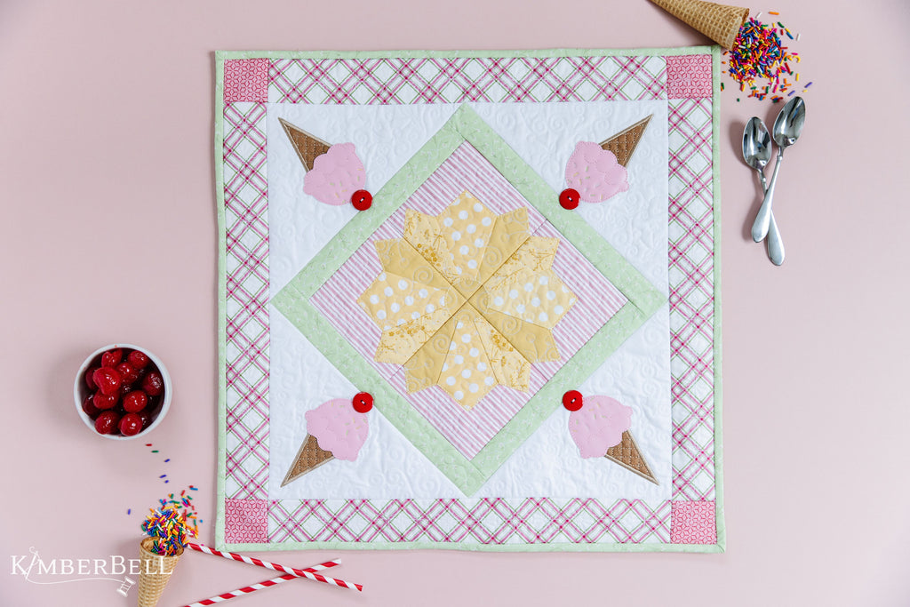 Summer-themed table topper with ice cream cones.