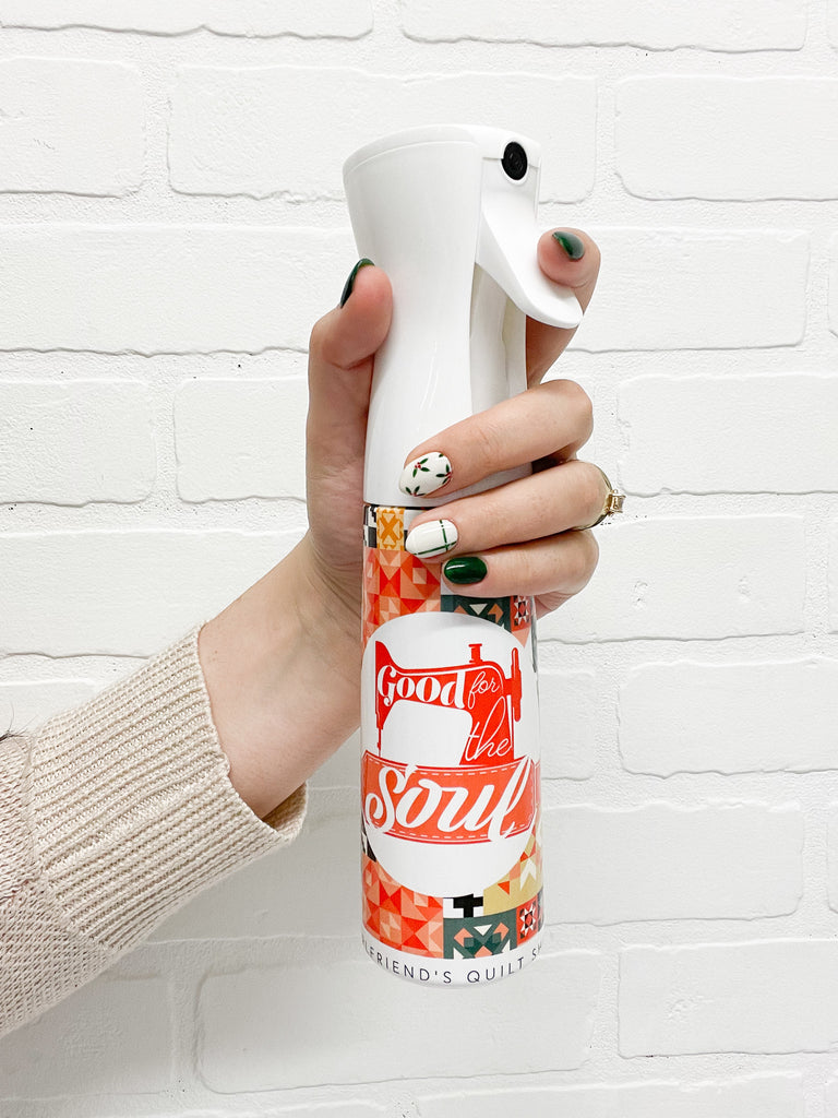 A brightly colored misting spray bottle that says "Good for the Soul"